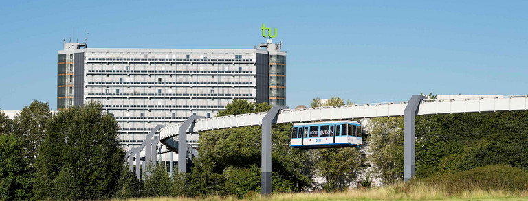 Math tower and H-Bahn with blue sky in the background
